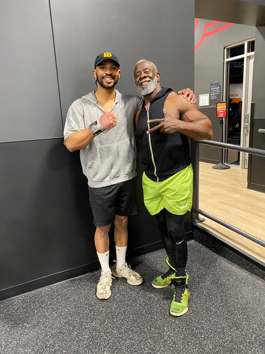 Health-Grail founder James Battley with a community member at the gym